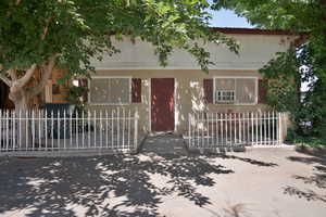 View of front of house with a fenced front yard