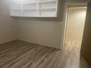 Spare room featuring hardwood / wood-style flooring