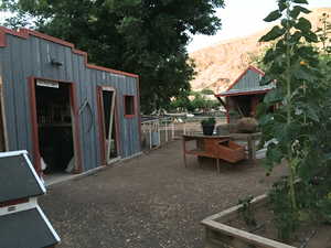 Exterior space featuring a mountain view and an outdoor structure