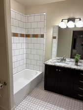 Bathroom with bathtub / shower combination and vanity