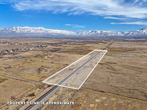 Birds eye view of property with a rural view and a mountain view