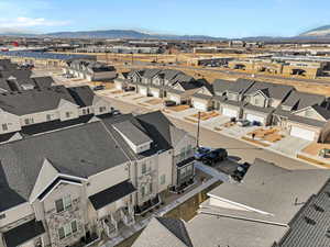 Birds eye view of property with a mountain view and a residential view