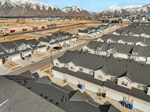 Birds eye view of property with a mountain view and a residential view