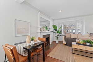 Beautiful Living Room with Gas Fireplace, Crown Molding, Can-Lighting, & Hardwood Floors