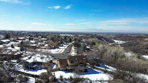 Snowy aerial view featuring a residential view