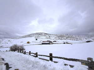 Snowy yard with a mountain view