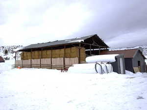 View of yard layered in snow