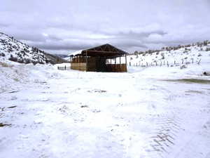 Snowy yard featuring a mountain view