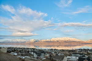 View of mountain feature with a water view and a residential view