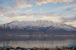 Property view of mountains with a water view