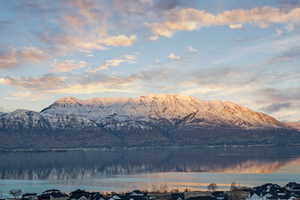 Mountain view featuring a water view