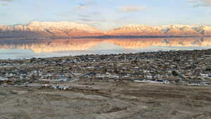 Birds eye view of property with a residential view and a water and mountain view