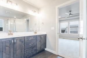 Bathroom with baseboards, a sink, visible vents, and tile patterned floors