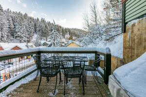 View of snow covered back of property