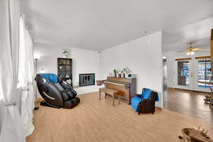 Sitting room featuring light wood-style floors and a fireplace