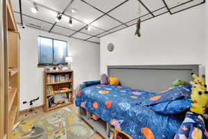 Bedroom with visible vents and track lighting