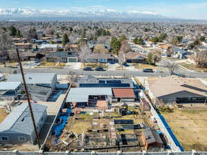 Birds eye view of property with a residential view and a mountain view