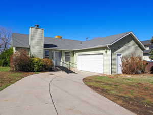 Ranch-style home with a garage located in a cul-de-sac