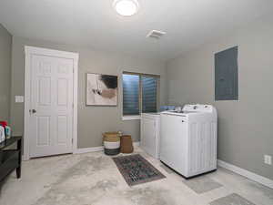 Washroom with laundry area, separate washer and dryer