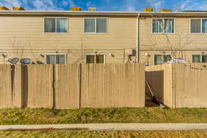 Back of house with fence