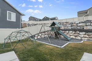 View of playground with a yard