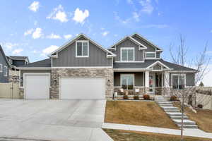 Craftsman house featuring a garage