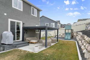 View of yard featuring a gazebo, a playground, and a patio