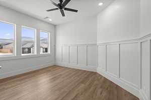 Office/Flex room with ceiling fan, light wood-style laminate flooring, a mountain view, and recessed lighting