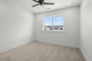 2nd level bedroom with light carpet, ceiling fan, and recessed lighting