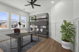Office space/Flex room featuring a mountain view and decorative wall. Virtually staged.