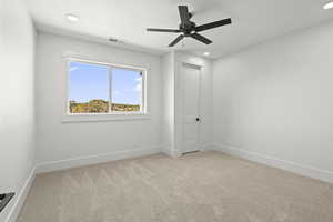 2nd floor bedroom featuring recessed lighting, light colored carpet, a ceiling fan, and closet