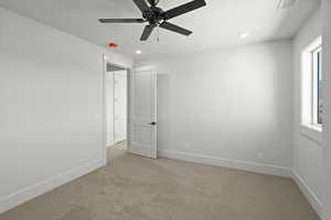 2nd level bedroom with a ceiling fan, recessed lighting, light carpet