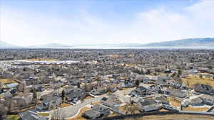 Birds eye view of property featuring a residential view and a mountain view