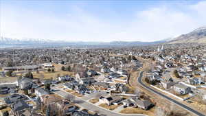 Birds eye view of property with a residential view and a mountain view