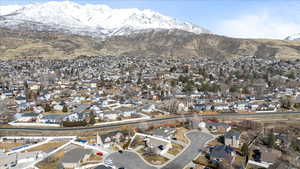 Property view of mountains with a residential view