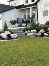 View of yard with covered porch