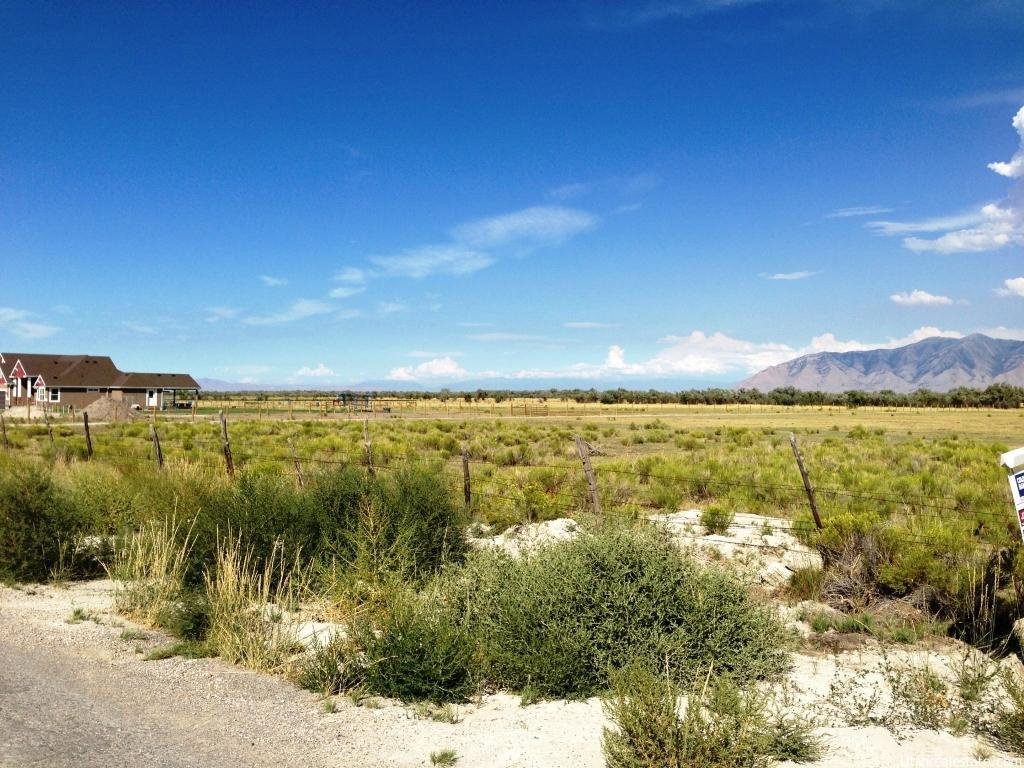 Property view of mountains with a rural view