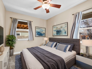 Bedroom with ceiling fan and baseboards