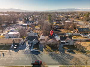 Birds eye view of property with a mountain view and a residential view