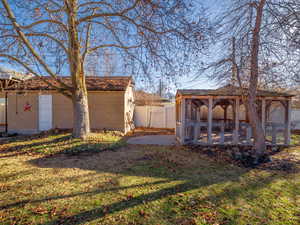 View of yard featuring fence