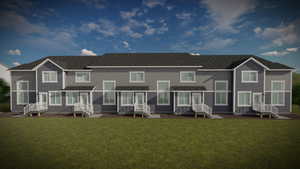 Rear view of property with a lawn