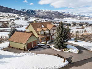 Snowy aerial view with a mountain view