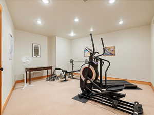 Workout area with recessed lighting, carpet flooring, and baseboards