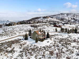 Snowy aerial view with a residential view and a mountain view