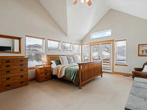 Bedroom with light colored carpet, a ceiling fan, access to exterior, baseboards, and visible vents