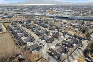 Birds eye view of property with a residential view and a mountain view