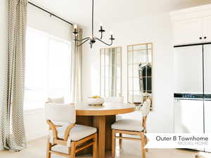 Dining area with a notable chandelier and light wood finished floors