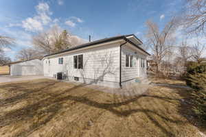 View of side of home with a garage,