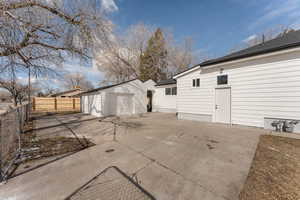 View of home's exterior featuring fence