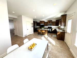 Dining space with recessed lighting, visible vents, and baseboards